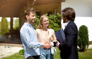 Islanders’ Choice Painting. A young married couple shaking hands with a painting representative. Very happy with the residential painting services.