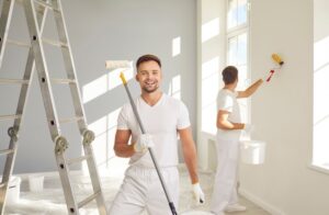 Islanders’ Choice Painting. Professionals painting interior room of house white.