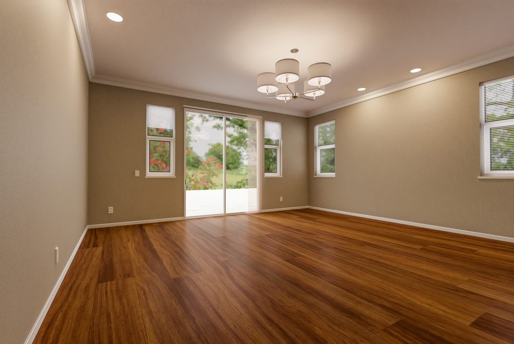 Painting Services. Newly Remodeled Room Of House with Finished Wood Floors, Molding, Paint and Ceiling Lights.